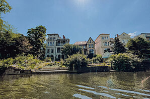 View of the river Oker and the houses behind it in beautiful sunshine.
