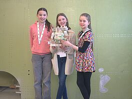 A group with their construct to protect their small passenger