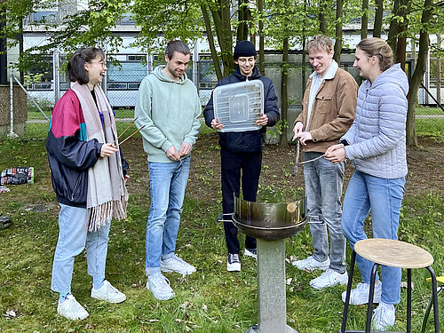 the iGEM team at barbecue preparations