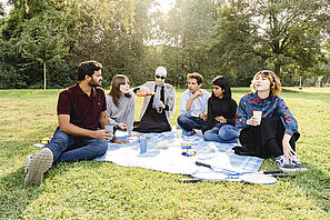 Students are having a picnic in Nordpark. 