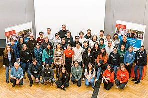 Group photo of the conference participants in the auditorium of the Haus der Wissenschaft.