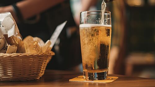 A beer being poured into a glass