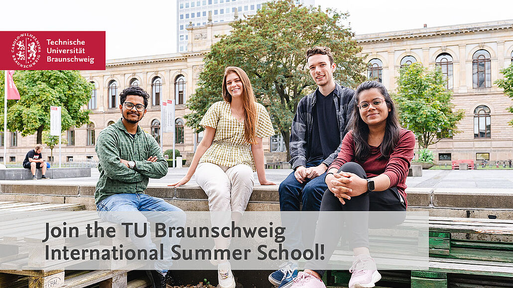 Four participants of the Summer School 2023 sit on the university square in front of the old building. 