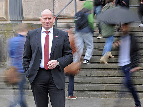 Vice President Dietmar Smyrek in front of the Historic Main Building.