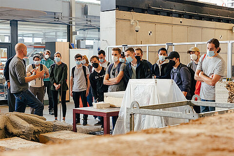A group of students on a tour of the Institute for Structural Design