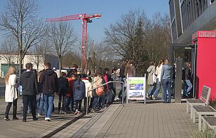 During the breakfast break, the students hurriedly made their way to the buffet