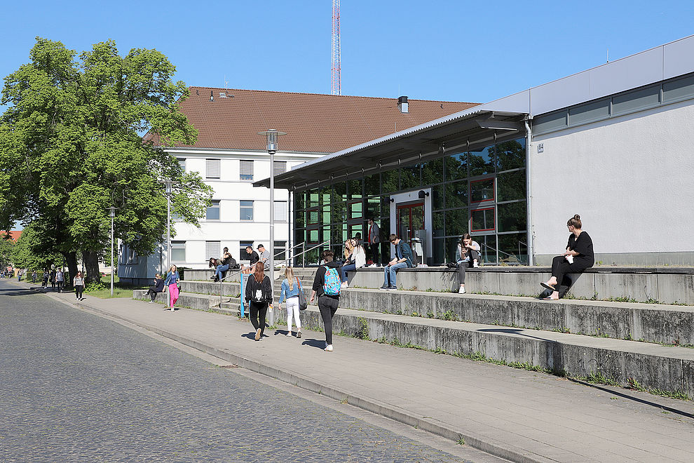 Students in front of the auditorium building on North Campus
