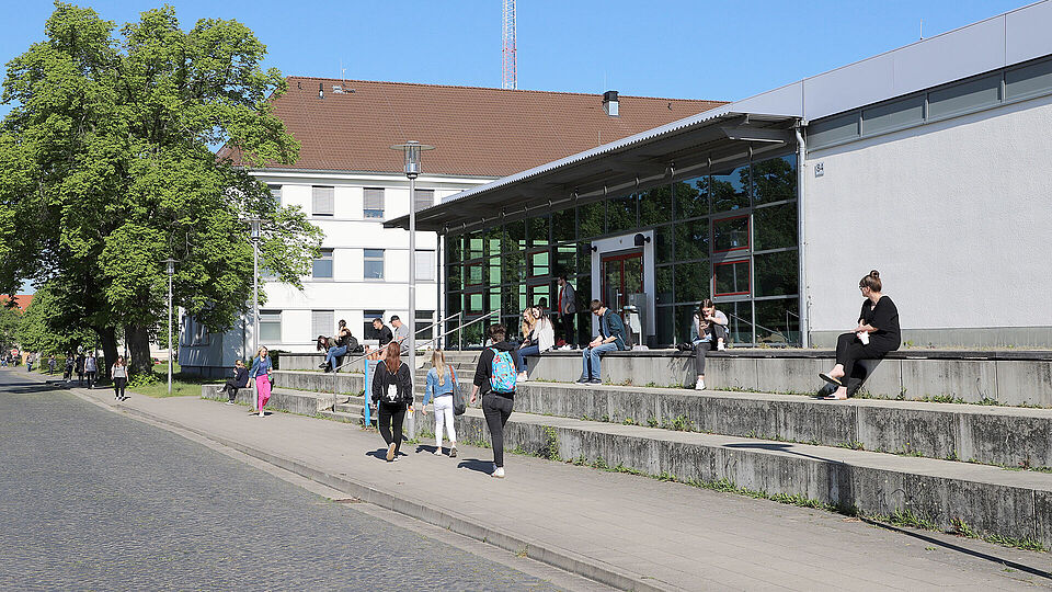 Students in front of the auditorium building on North Campus