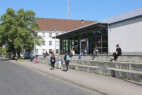 Students in front of the auditorium building on North Campus