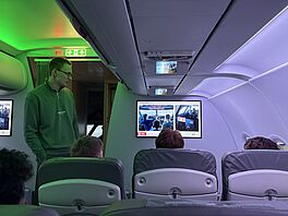 The students of the Swedish delegation try out the cabin simulator of the IFF