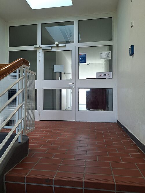 Picture of a door at the top of a staircase