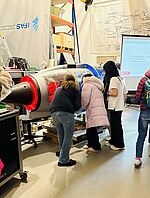 The pupils take a look inside a turbine