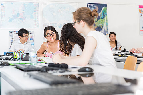  Students sit at PCs.