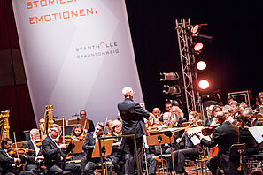 One person conducting an orchestra in the City Hall Braunschweig